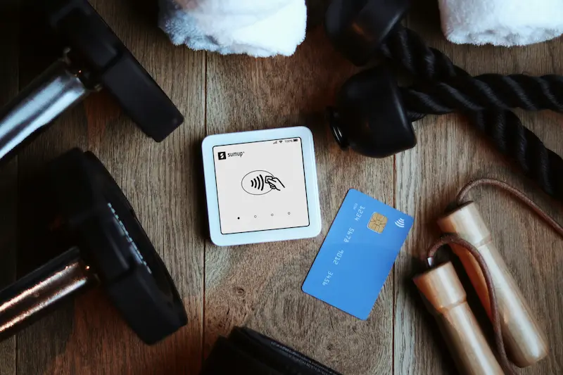 Fitness gear and a payment card on a table, illustrating how Vitality rewards and benefits work together